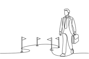Businessman standing at a crossroads with multiple paths ahead