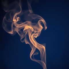 Smoke swirling in elegant patterns against a dark blue background  