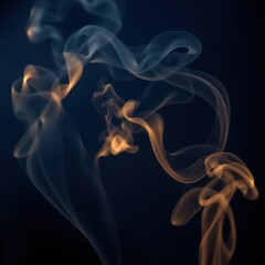 Fototapeta premium Colorful smoke patterns in blue and orange on dark background 