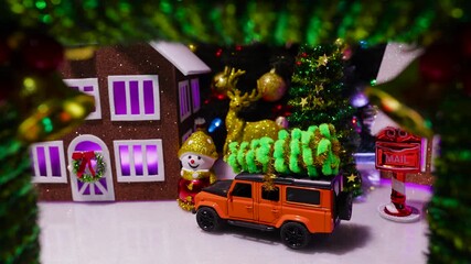 In the middle of the Christmas wreath with bells, a close-up of the Christmas town