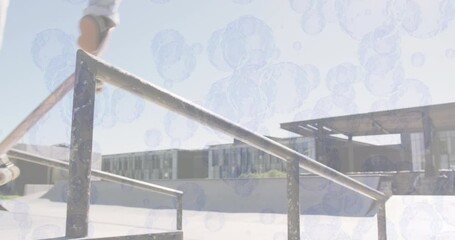 Animation of bubbles over caucasian man skateboarding - Powered by Adobe