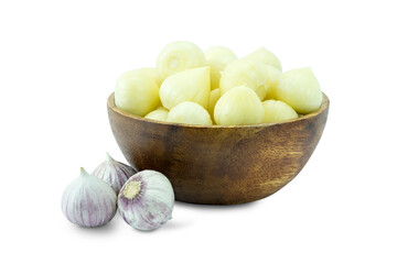 bowl of garlics, Peeled solo garlics or single clove garlics in wooden cup and unpeeled isolated on white background close up clipping path stack.