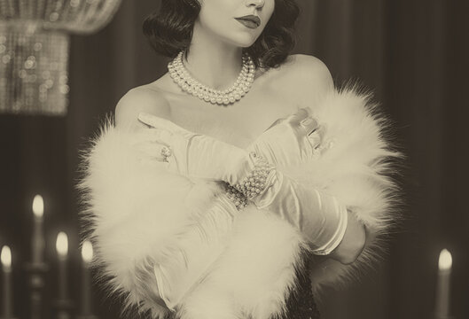 sepia color black and white film old style photo real person retro lady roaring sexy woman. Flapper girl in room 20s. Close-up portrait make-up face lips, cape boa fur fox pearls on shoulders 1920s