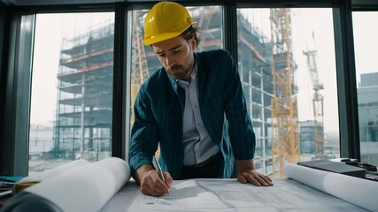 Civil engineer is examining architectural schematics and comparing data with fieldwork progress observed via office windows. - Powered by Adobe