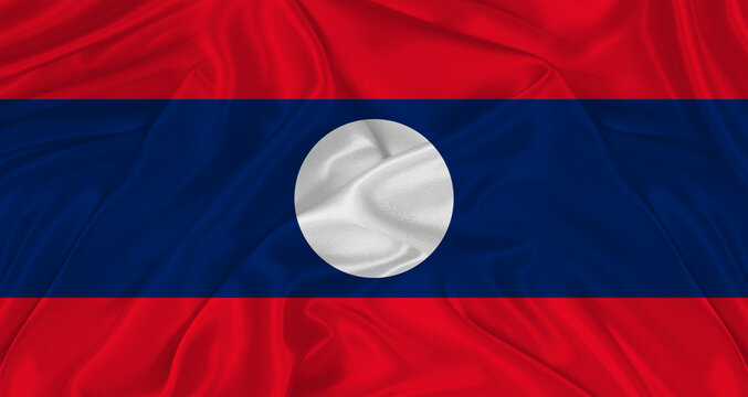 Flag of Laos with cloth texture. Close up of Laos flag waving