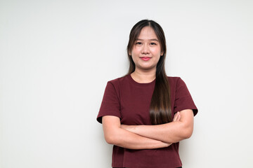 Obraz premium Studio portrait of young Asian woman arms crossed against white background