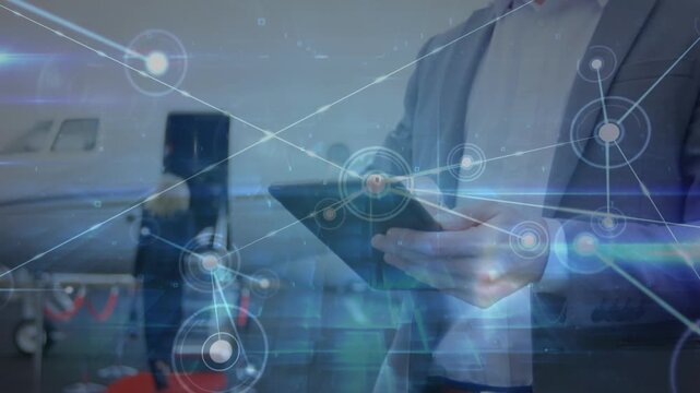 Animation of network of connections over businessmen using smartphone at the airport