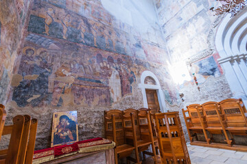 Vibrant fresco murals decorate the interior walls of Studenica Monastery, showcasing Byzantine religious art, historic Serbian architecture, and spiritual heritage in a sacred setting.