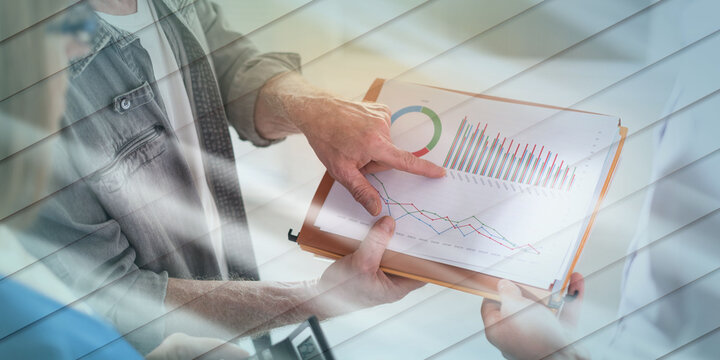 Business people discussing about financial results, light effect, geometric pattern