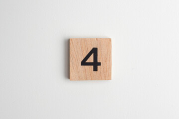 Single wooden block with the number 