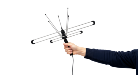 unleash crystalclear television a hand holds a sleek, modern indoor tv antenna, ensuring superior reception and broadcast clarity, isolated on transparent background