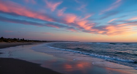 Fototapeta premium Tranquil sunset beach scene pink and blue sky ocean waves serene seascape coastal landscape nature photography