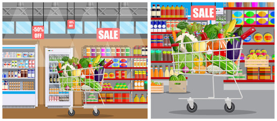 Shopping cart full of fresh fruit and vegetable inside a grocery store. Supermarket interior background for healthy food concept.