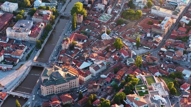 Cinematic aerial close-up of Sarajevo old town with Sebilj fountain, Vijecnica, and traditional Ottoman architecture