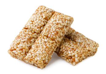 Two pieces of kozinaki with sesame seeds on a white background. Isolated