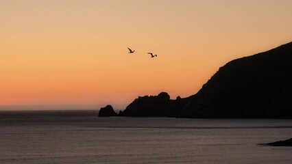 Finisterre Sunset in Galicia, Spain. Mar de Fora beach and Nave cape in Costa da Morte. This is the final step in the Camino de Santiago.
