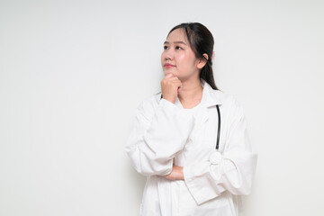 Portrait of Southeast Asian healthcare worker woman doctor in lab coat thinking