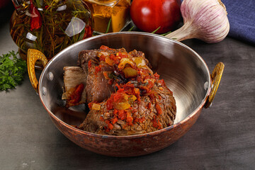 Baked beef ribs with vegetables