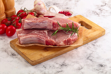 Raw potk loin steak with bone