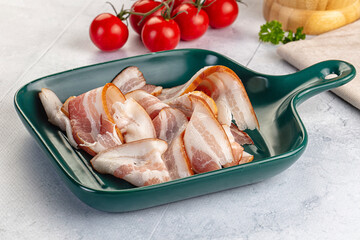 Raw pork tenferloin with bacon