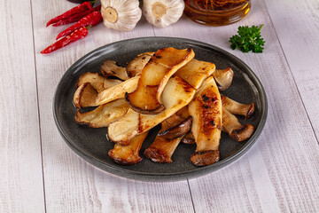 Roasted eringi mushrooms in the plate