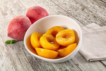 Sweet ripe yellow canned peaches