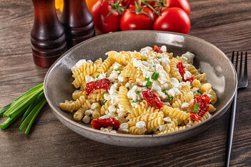 Italian pasta fusili with curd