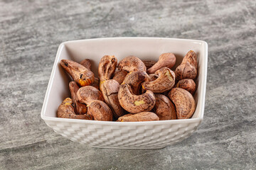 Unpeeled cashew nuts in the bowl