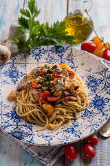 spaghetti with fresch anchovy  tomato and capers