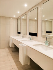 Cleanliness and modern design, a well maintained public restroom with sleek fixtures