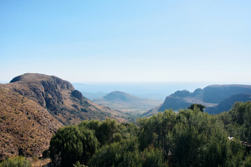 Obraz premium Marakele National Park safari game drive in Limpopo province, South Africa, with amazing scenic views of mountains, savanna, and wildlife habitat. The landscape combines rugged peaks, open grasslands,
