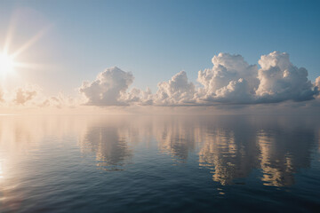 Obraz premium Serene sunset over a calm sea, reflecting fluffy clouds in the water. Golden sunlight and peaceful vibes. 
