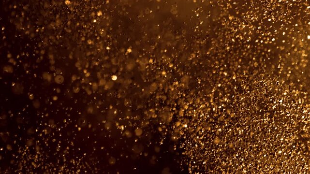 Super Slow Motion Shot of Glittering Golden Background at 1000fps.