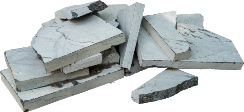 Pile of rough cut stone slabs in various sizes and shapes.