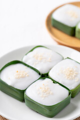Traditional Thai dessert (Khanom Tako), Pudding with coconut cream topping in pandan leaf