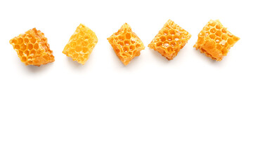 Sweet honeycombs on white background