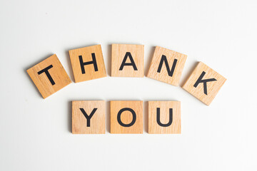 Wooden Scrabble tiles with the letters 