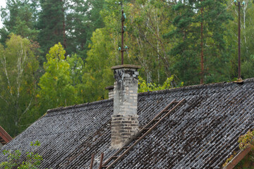 old roof of the old house with chimney