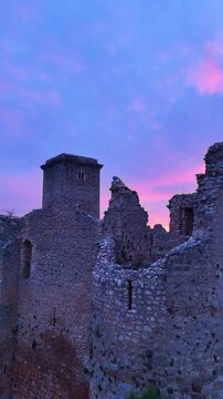 Aerial view from a drone of the sunset at the castle in the town of Ucero, in the Burgo de Osma region, Soria Province, Autonomous Community of Castile and Leon, Spain. Europe