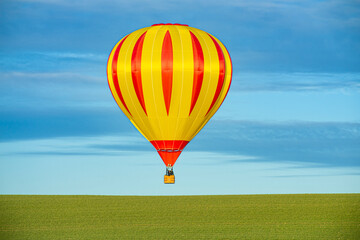 Fototapeta premium Hot air balloon is just relieved, and later ready for landing