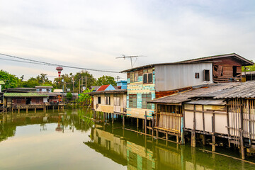 Life village houses along Prem Prachakon canal river Bangkok Thailand.