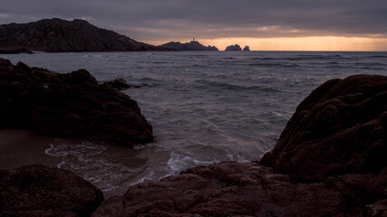 Cape Vilan Lighthouse and Reira beach in Camariñas, Galicia, Spain. First electrical lighthouse in Spain. This lighthouse was the first electrical lighthouse in Spain.