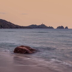 Cape Vilan Lighthouse and Reira beach in Camari&ntilde;as, Galicia, Spain. First electrical lighthouse in Spain. This lighthouse was the first electrical lighthouse in Spain.
