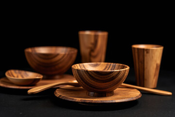 Natural wooden cutlery set including spoon, fork, and knife on rustic background, crafted from eco-friendly materials for sustainable dining and kitchen lifestyle visuals