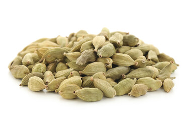Pile of cardamom spice on white background