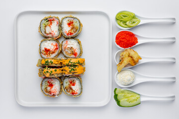 Baked sushi roll with salmon, tuna, shrimp, avocado and cream cheese