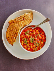 curried chickpeas and sauteed spinach in a tomato broth served with toasted pita bread