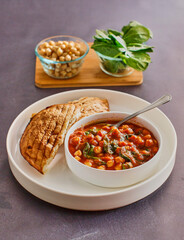 curried chickpeas and sauteed spinach in a tomato broth served with toasted pita bread