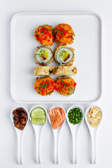 Baked sushi roll with salmon, tuna, shrimp, avocado and cream cheese