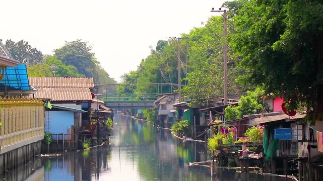Life village houses along Prem Prachakon canal river Bangkok Thailand.